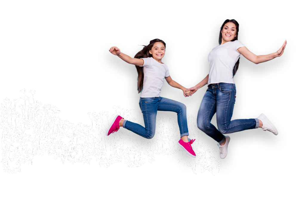 Mother and daughter jumping in flowers